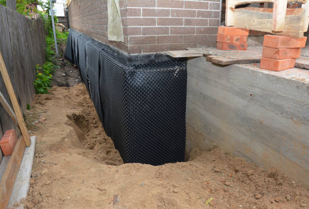 Happy homeowners after waterproofing job in Osseo